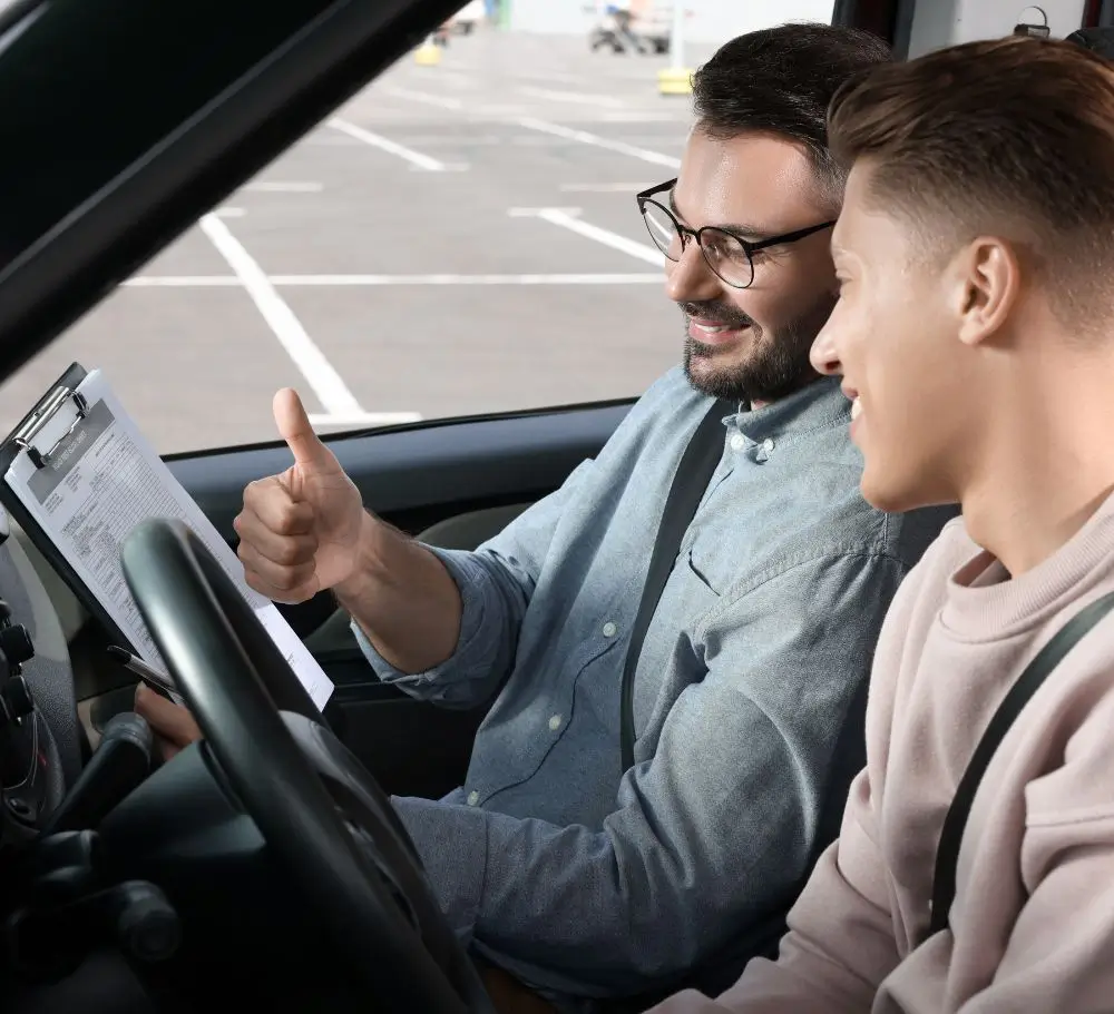 Driving Instructor and Student in Car