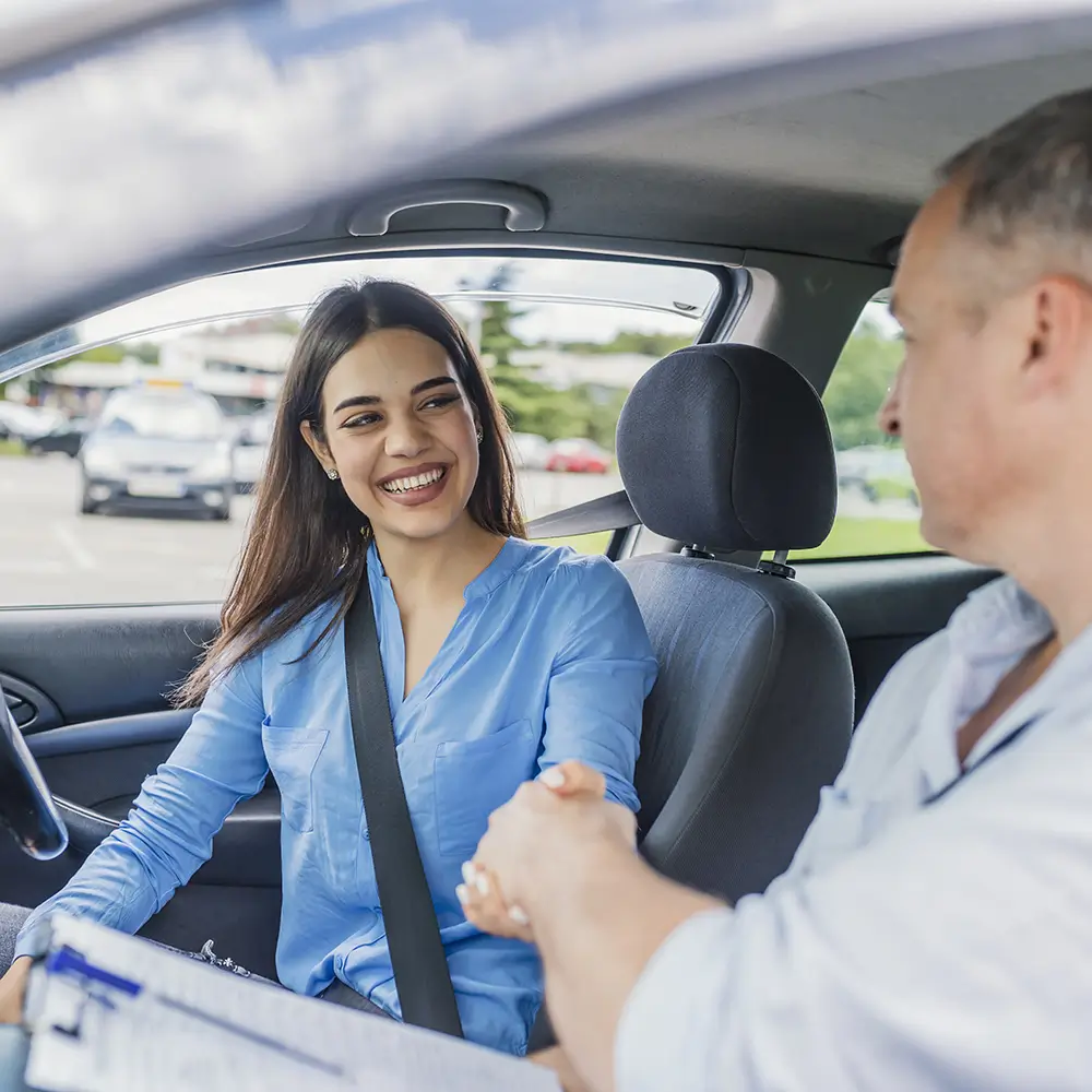 Instructor helping senior driver